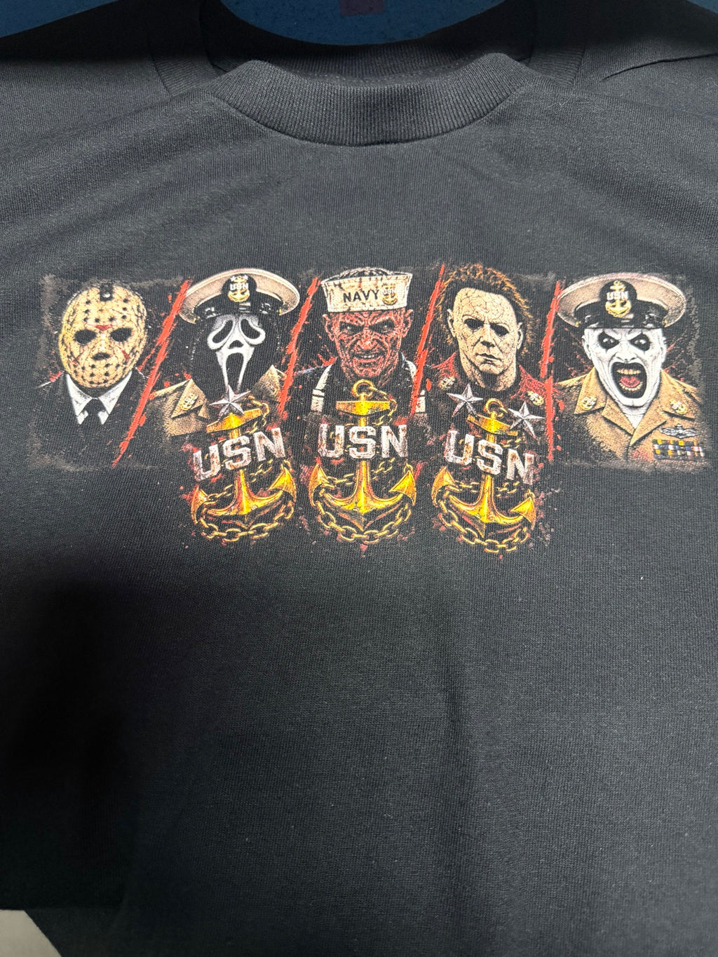 Chief Art Faces of Fear 2026 chest graphic on black T-shirt