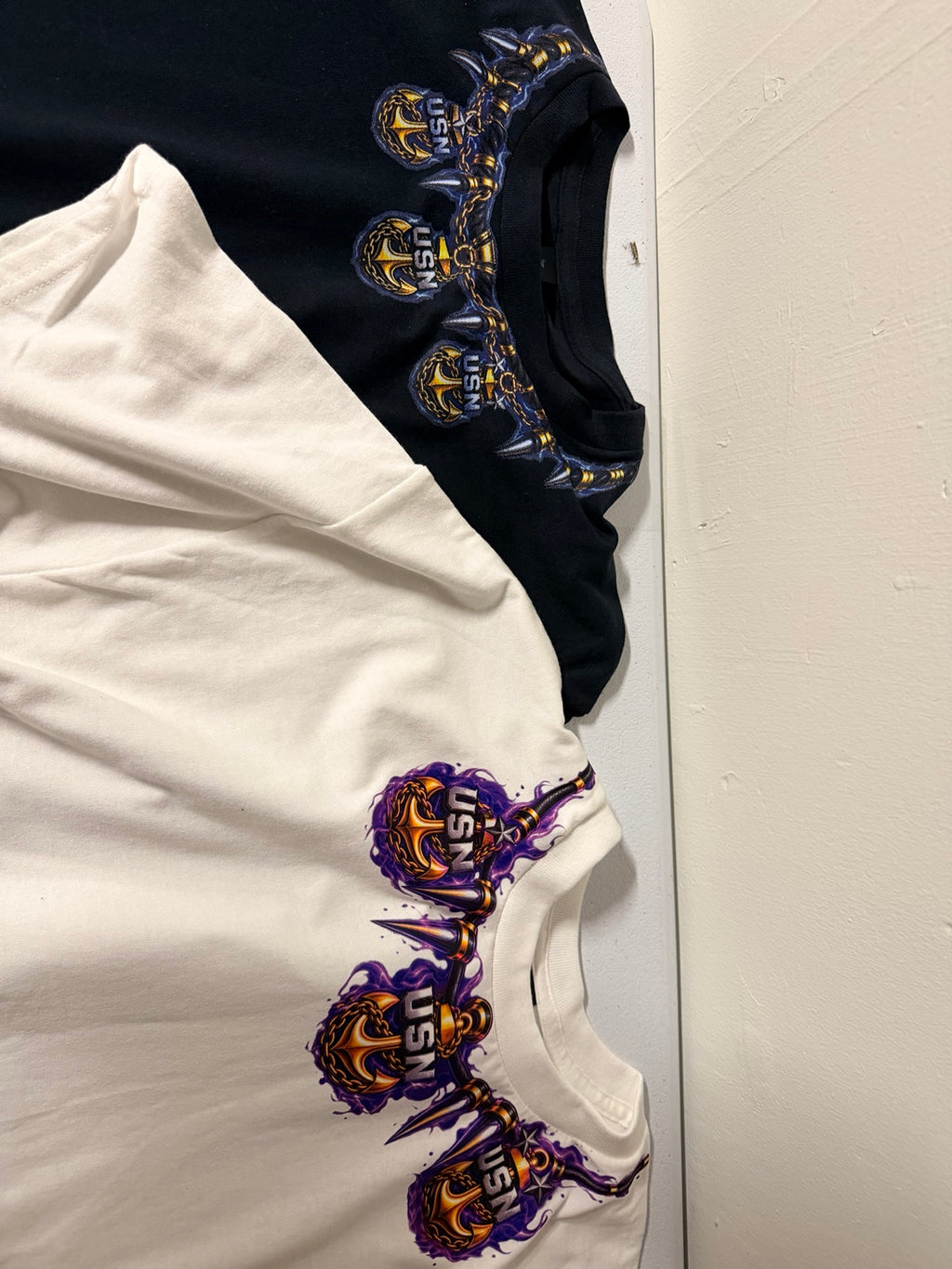 Lineage Set neckline anchor details on both shirts