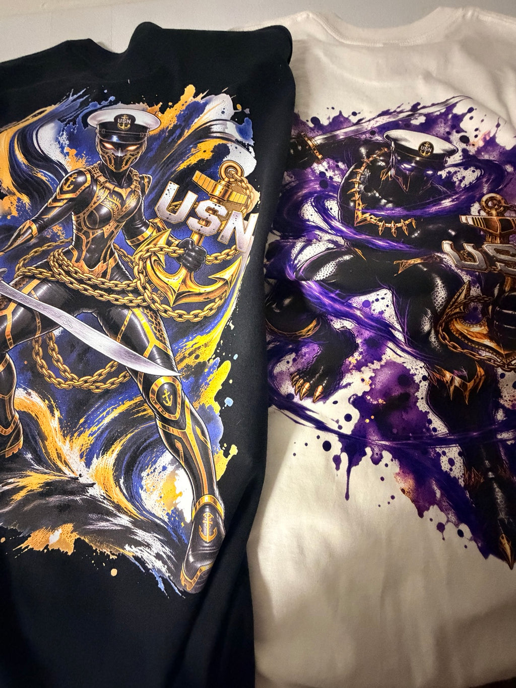 Purple Panther white shirt and Gold Panther black shirt shown together